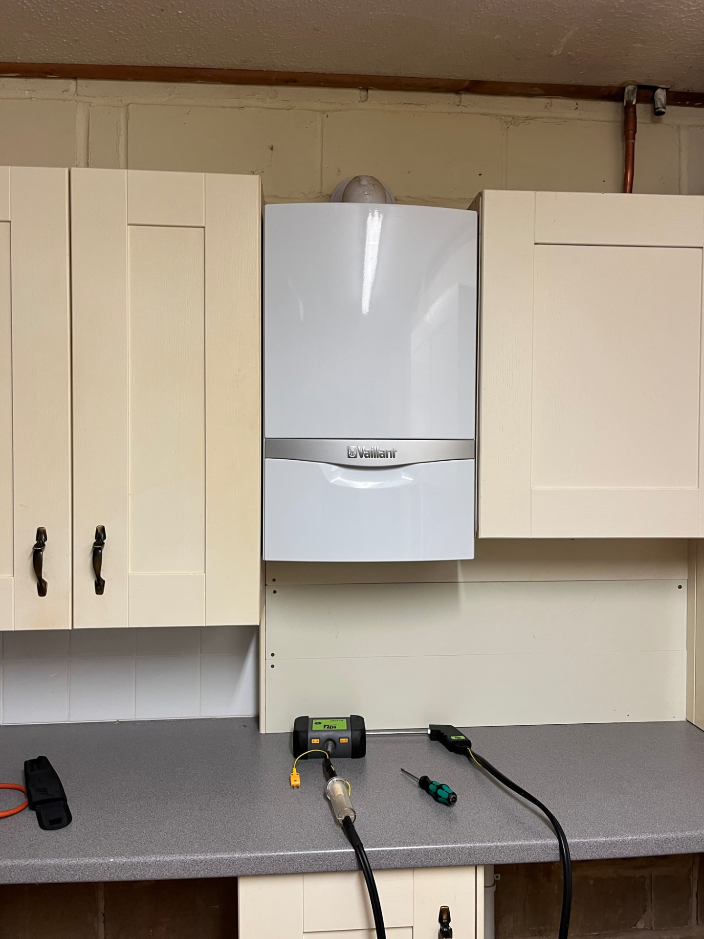 Vaillant boiler installed and flue-gas tested in a utility room
